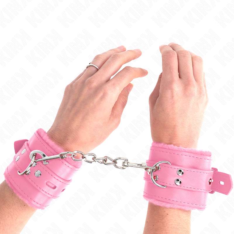 KINK - FUR LINED WRIST RESTRAINTS WITH SQUARE HOLES PINK AND PINK BELT ADJUSTABLE 17-29 CM X 6 CM KINK - FUR LINED WRIST RESTRAINTS WITH SQUARE HOLES PINK AND PINK BELT ADJUSTABLE 17-29 CM X 6 CM